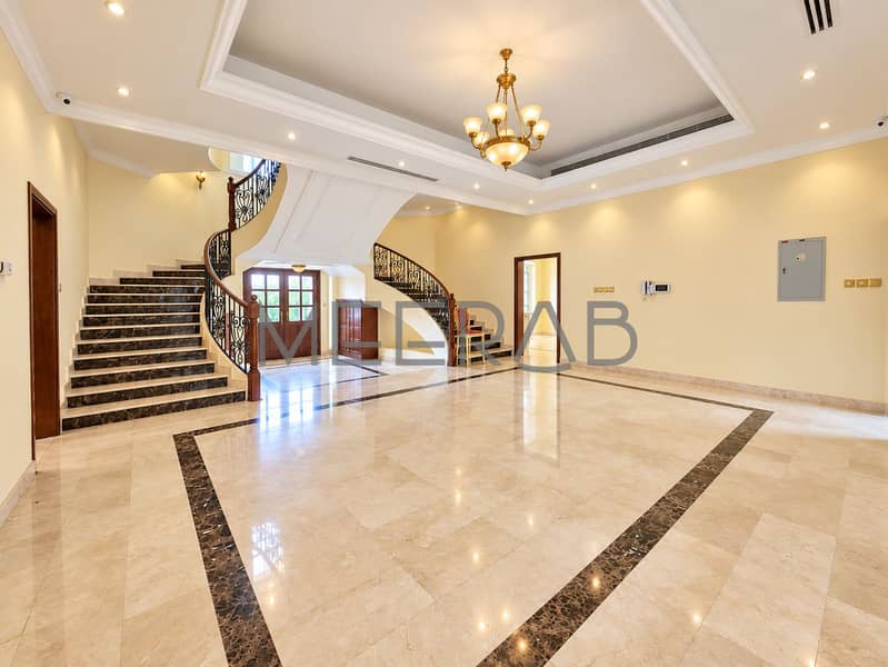 4 Luxurious Marble Foyer with Curved Staircase. png