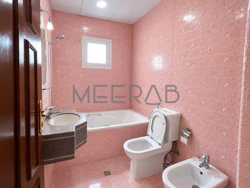 11 Bright Pink-Tiled Bathroom Interior. png