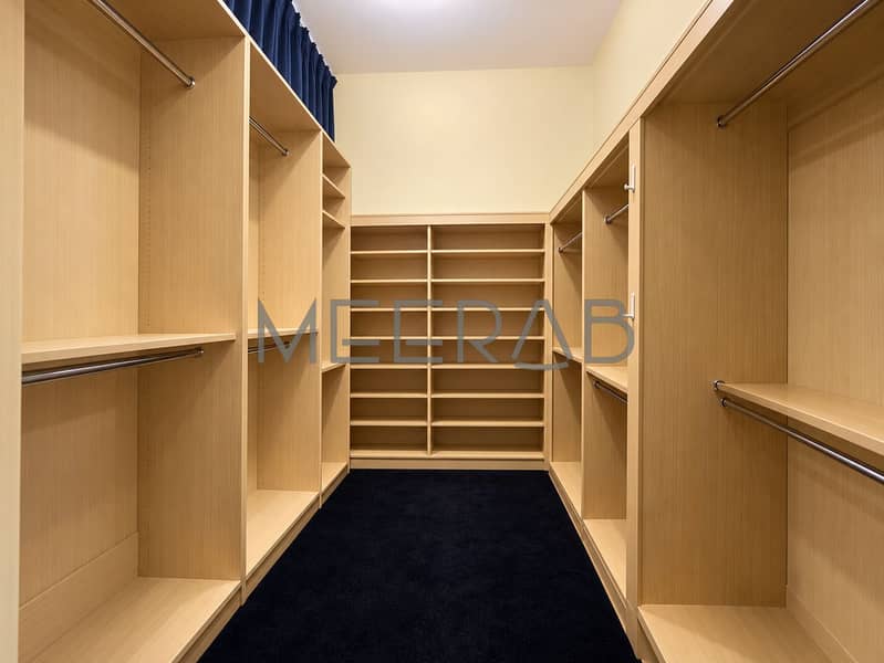 13 Minimalist Empty Luxury Walk-In Closet. png