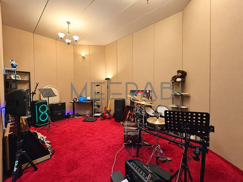 14 Warmly Lit Music Studio Rehearsal Room. png