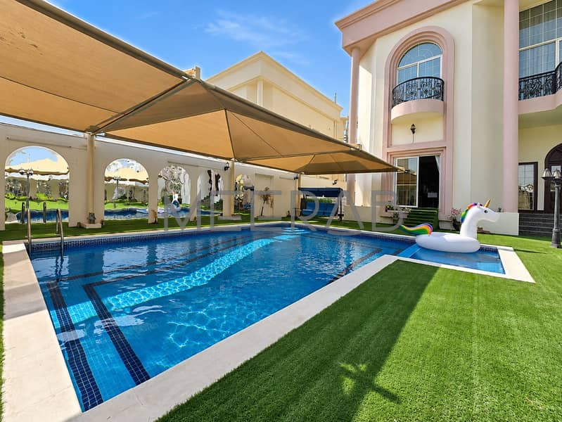 16 Sunlit Villa Pool with Rainbow Unicorn Float. png