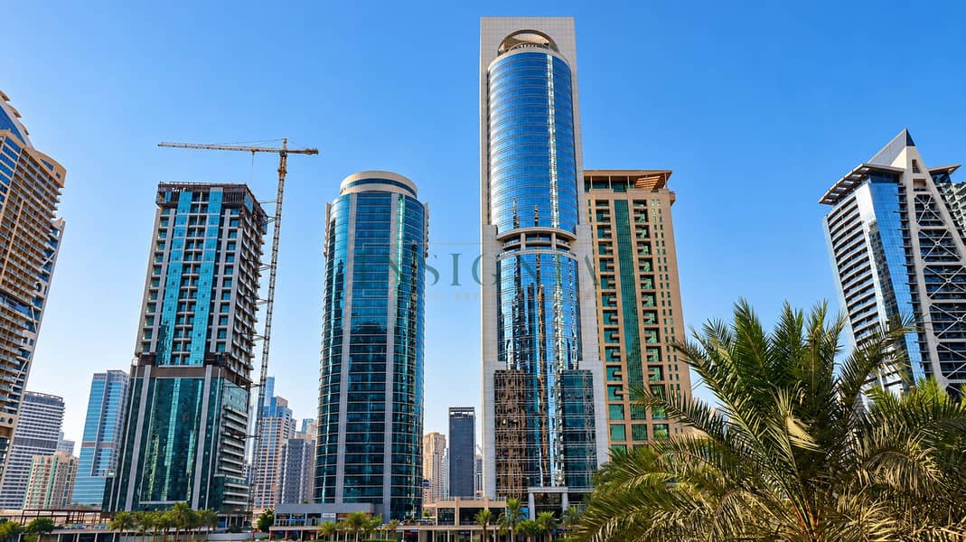 6 Dubai Skyline with Reflective Towers and Palms. png