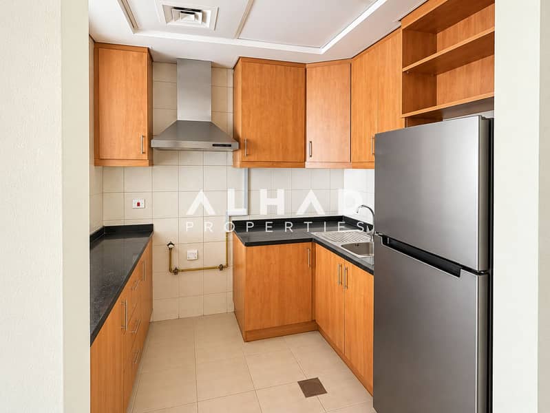 6 Bright Modern Wood-Tone Galley Kitchen. png