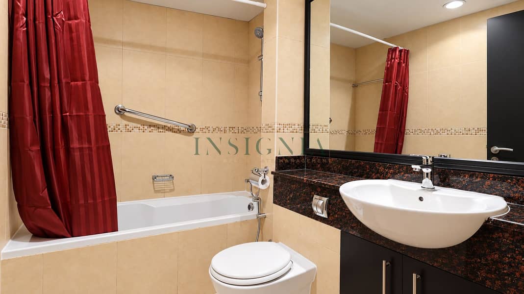 10 Modern Beige Bathroom with Maroon Shower Curtain. png