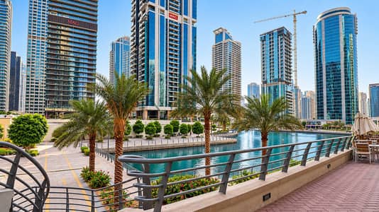 Studio zum Miete in Jumeirah Lake Towers (JLT), Dubai - Sunny Waterfront Marina Skyline with Palms. png