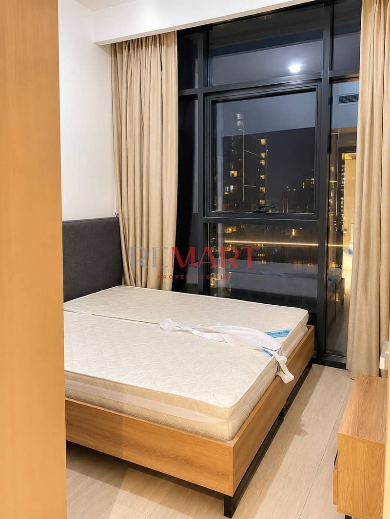 4 Modern Bedroom Overlooking City Lights. png