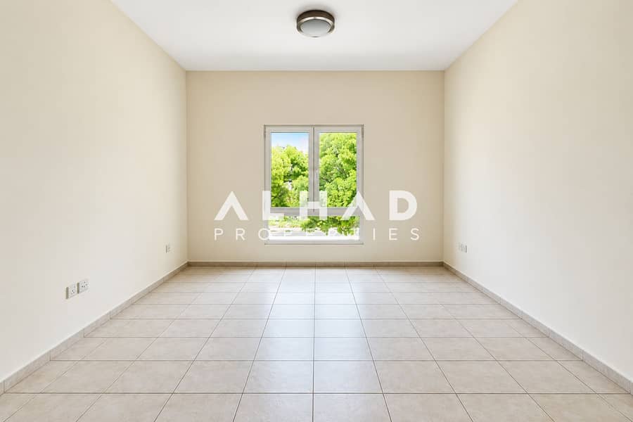 4 Bright Minimalist Room with Green View. png