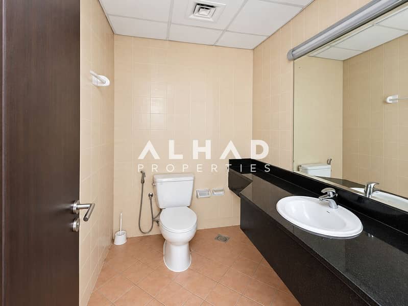 10 Modern Beige-Tiled Bathroom Interior. png