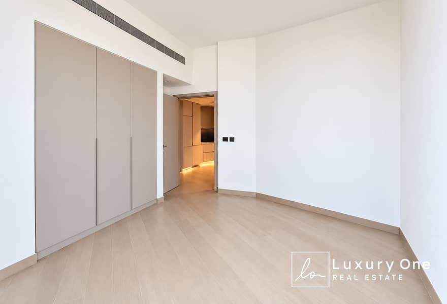 4 Minimalist Taupe Room with Warm Hallway. png