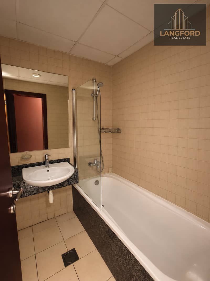 12 Warm Minimalist Beige-Tiled Bathroom. png