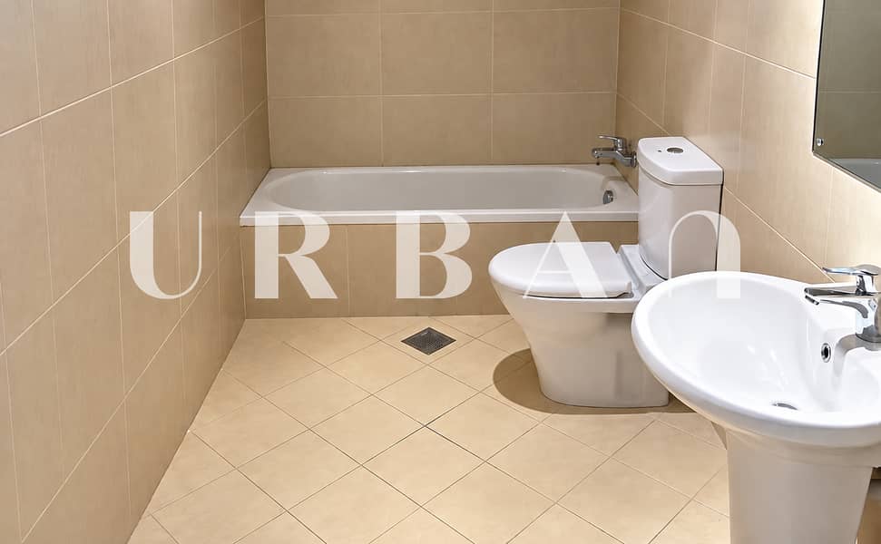 5 Minimal Beige Tiled Bathroom. png