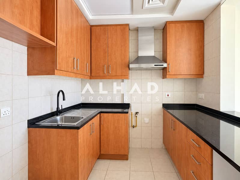 3 Warm Wood U-Shaped Kitchen Interior. png
