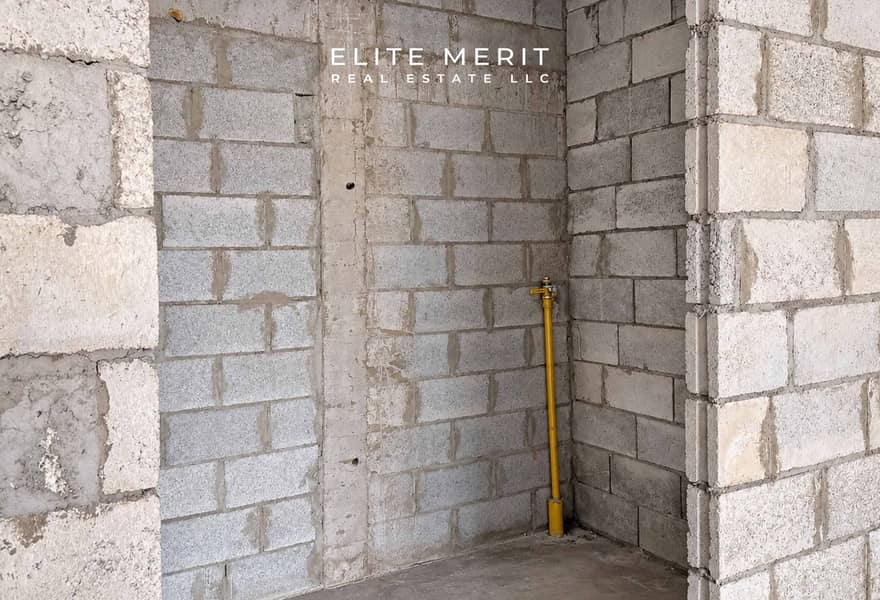 7 Unfinished Concrete Room with Yellow Pipe. jpg