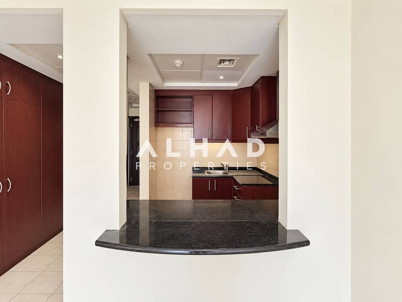 7 Modern Kitchen Pass-Through with Granite Bar. png