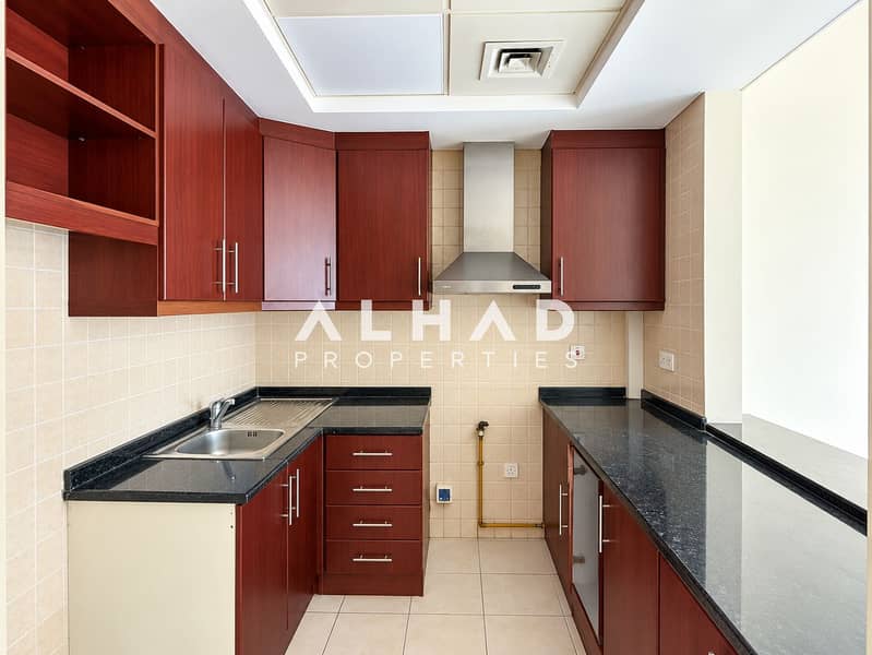 8 Symmetrical Cherry-Wood Kitchen Interior. png