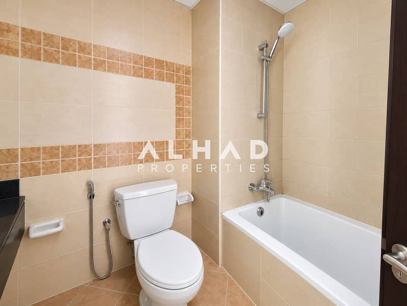 9 Modern Beige Bathroom with Tub and Toilet. png