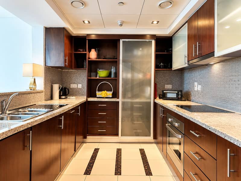 4 Modern Symmetrical Dark Wood Kitchen. png