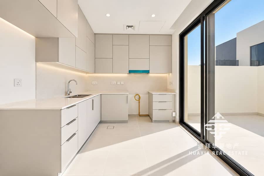 3 Sunlit Minimalist Kitchen with Patio Doors. png