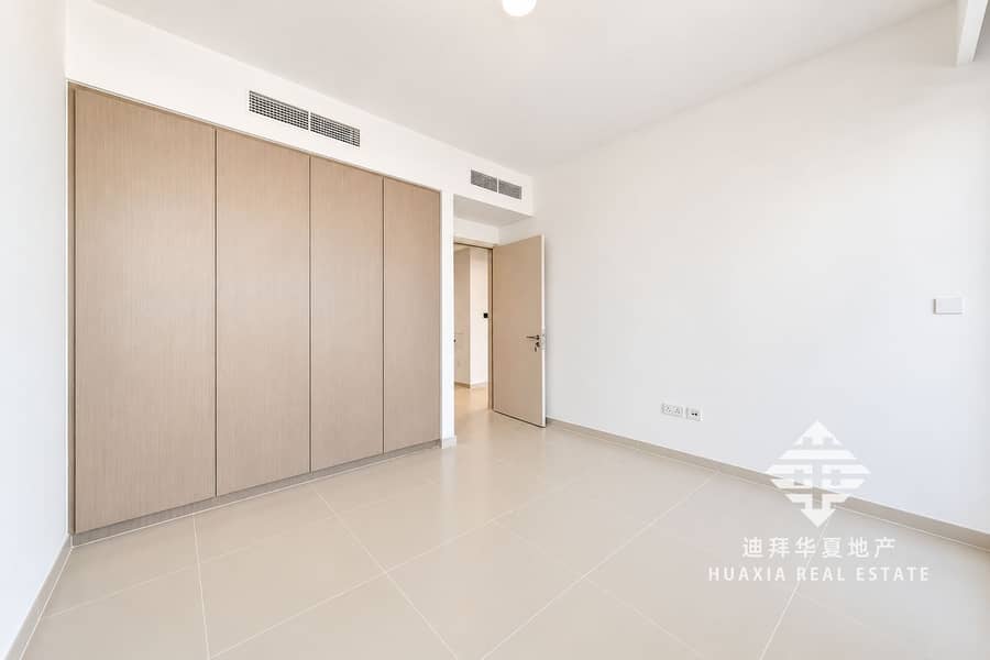 9 Minimalist Beige-Tiled Room with Wardrobe. png