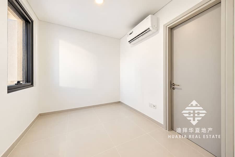 11 Bright Minimalist Room with Window and AC. png