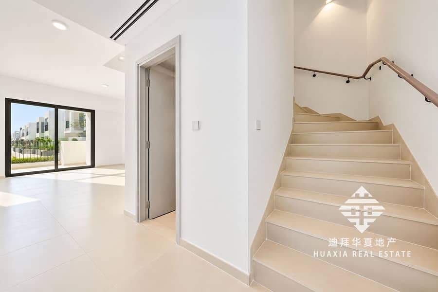 12 Sunlit Minimalist Entryway with Staircase. png