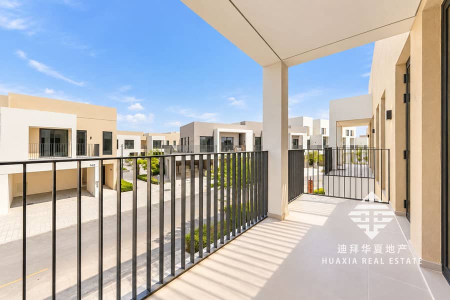 20 Sunlit Modern Terrace Overlooking Townhomes. png