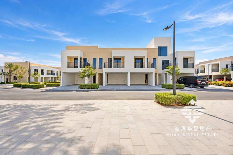 25 Modern Townhouse Community Under Blue Skies. png