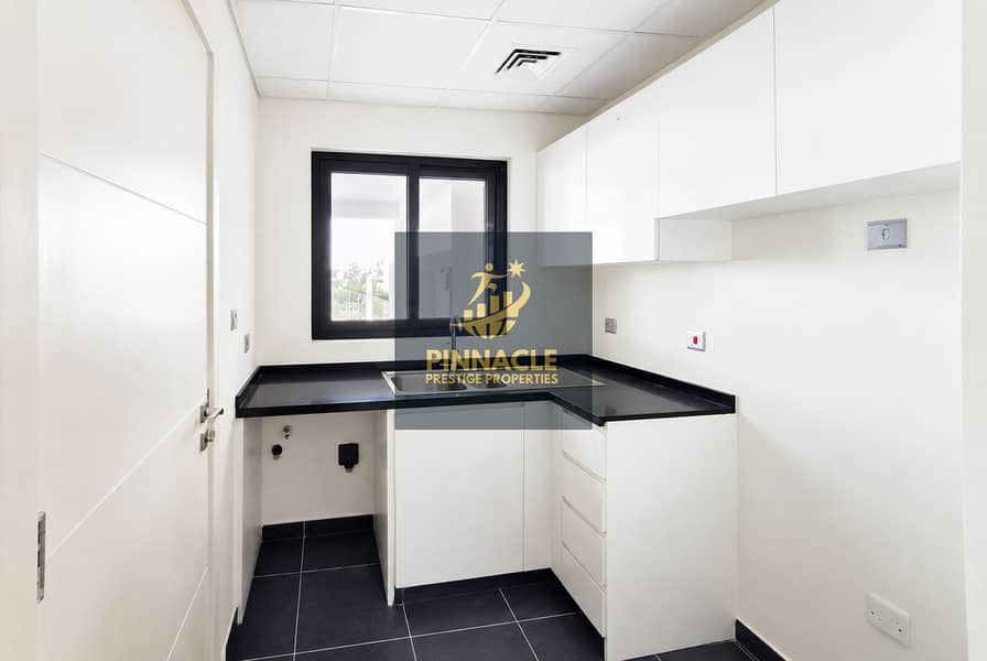 5 Minimalist White Kitchenette with Window. png