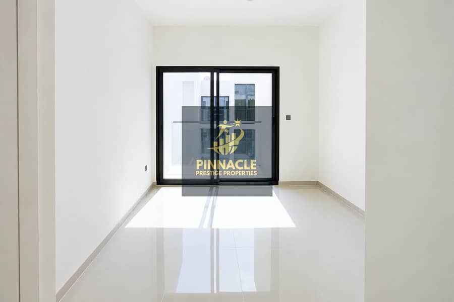 6 Sunlit Minimal Room with Sliding Glass Doors. png