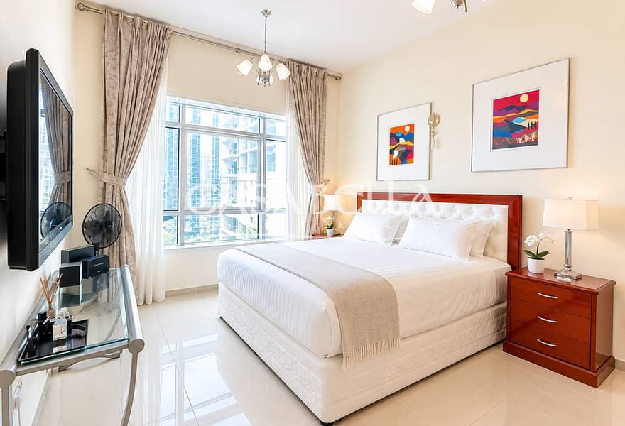 4 Bright Modern Bedroom with City View. png