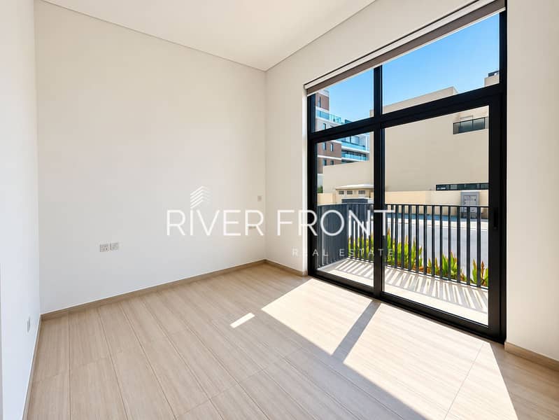 5 Sunlit Minimalist Room with Balcony View. png