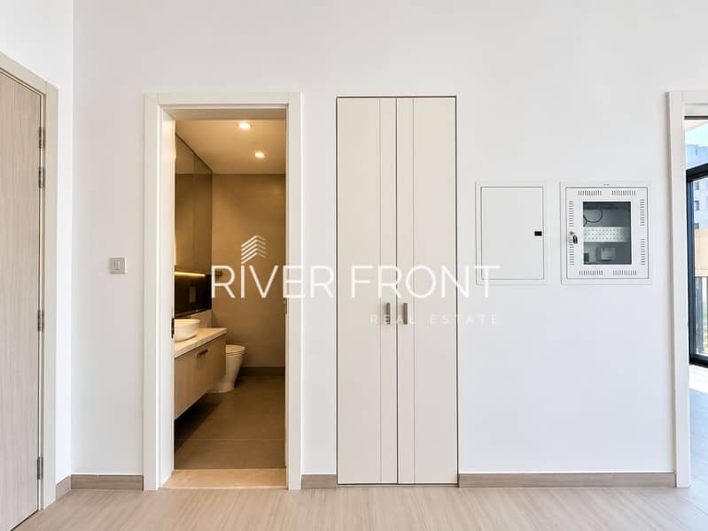7 Minimalist Modern Entryway with Bathroom View. png
