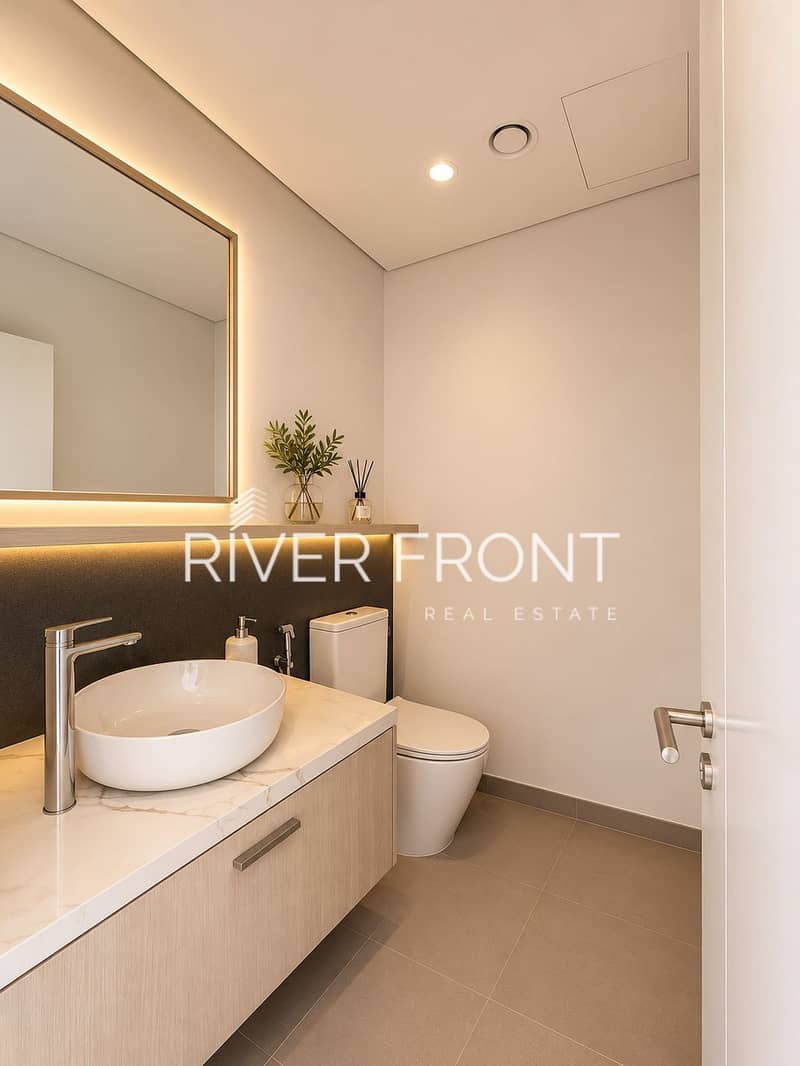 9 Warm Minimalist Bathroom with Glowing Vanity. png