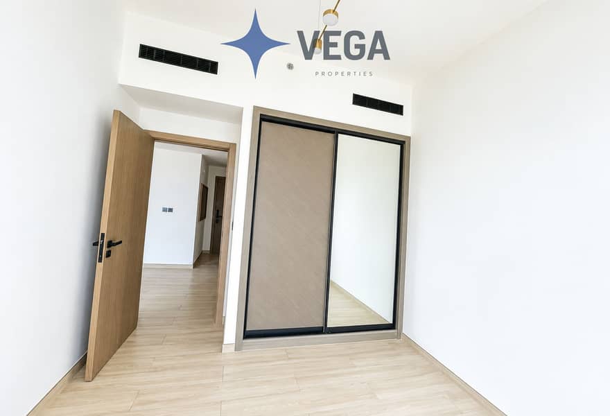 5 Bright Minimalist Room with Mirrored Closet. png