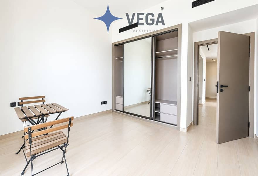 6 Bright Minimalist Room with Mirrored Wardrobe. png