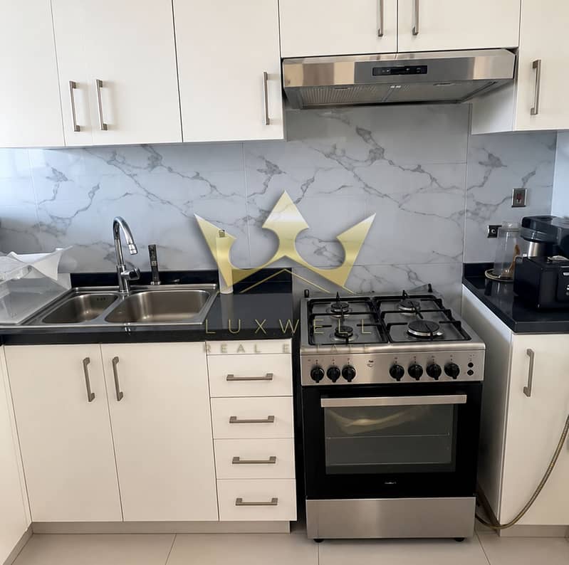 4 Modern White Kitchen with Stainless Steel Range. png