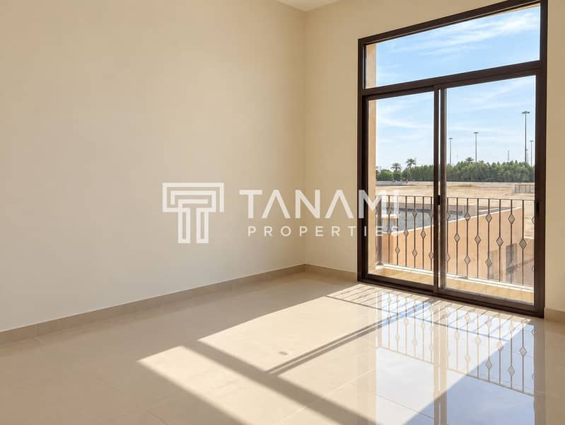 6 Sunlit Empty Room with Balcony Views. png