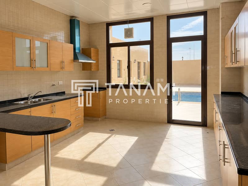 8 Sunlit Modern Kitchen with Pool View. png