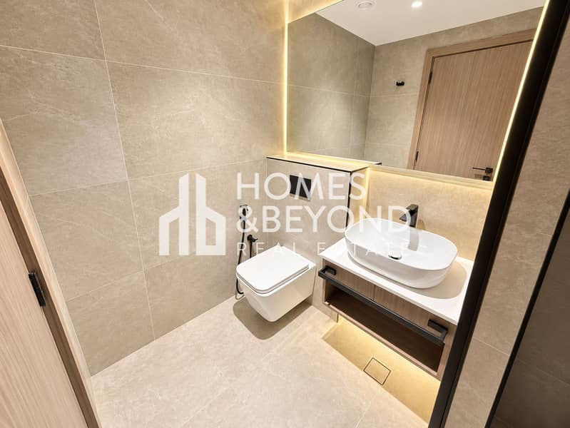7 Warm Minimalist Stone Bathroom. png