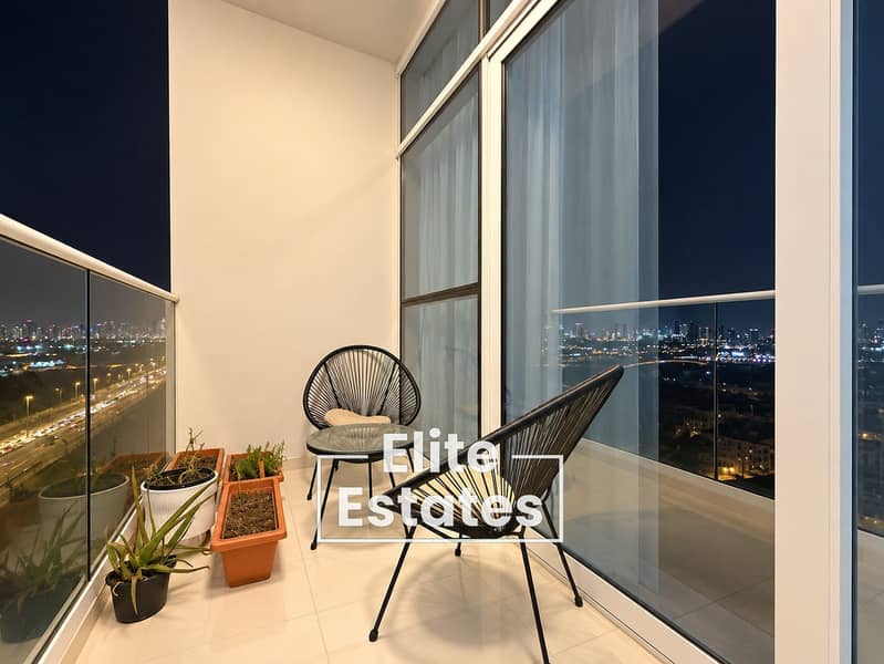 7 Modern Balcony Overlooking City Lights. png