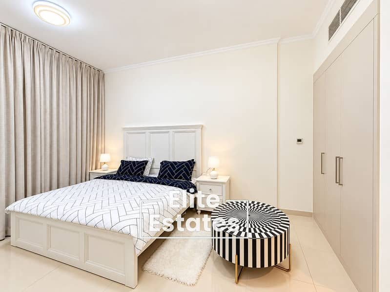 10 Modern Cream Bedroom with Striped Ottoman. png