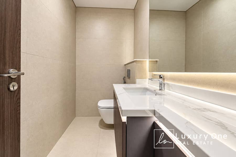 7 Modern Beige Minimalist Powder Room. png