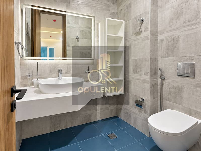 6 Modern Blue-Tiled Bathroom Interior. png