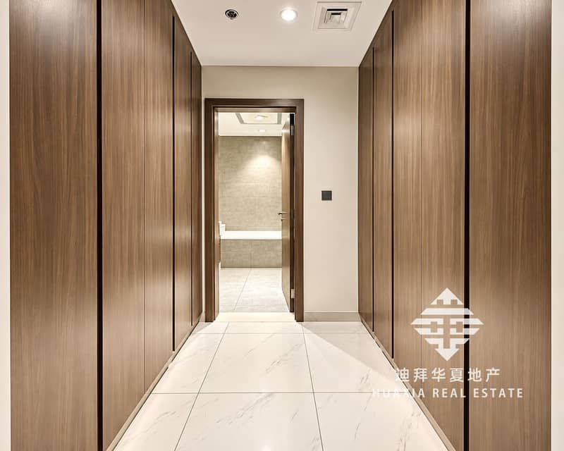 6 Symmetrical Walnut Wardrobe Hallway to Bathroom. png