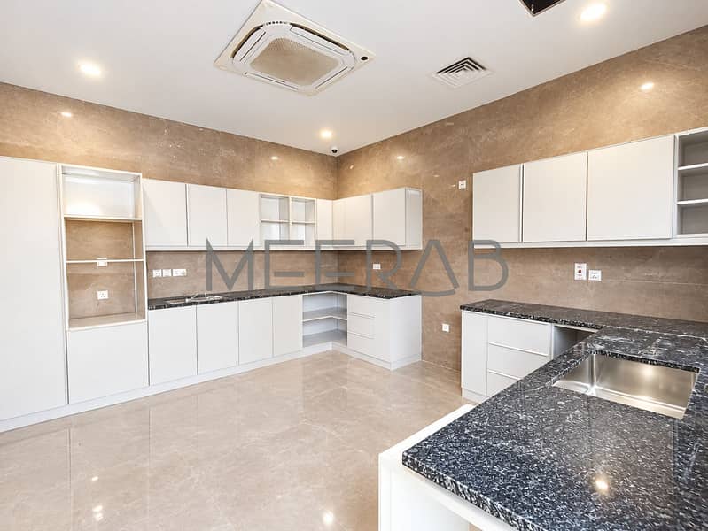 8 Modern Marble Kitchen with Glossy Finishes. png