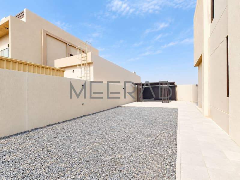 11 Modern Beige Courtyard with Slatted Gate. png