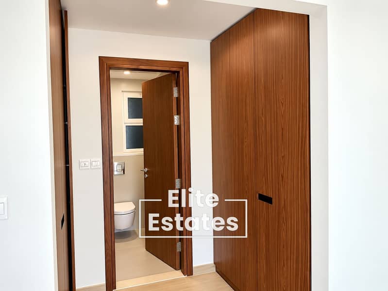 10 Modern Walnut Hallway to Bathroom. png