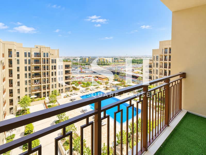 10 Sunny Balcony Overlooking Pool and City. png