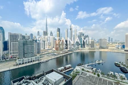 2 Bedroom Apartment for Rent in Business Bay, Dubai - Fully Furnished | Burj and Canal Views | Luxurious