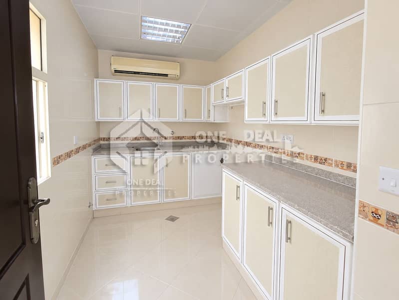 6 Bright, Spotless Cream-Tiled Kitchen. png